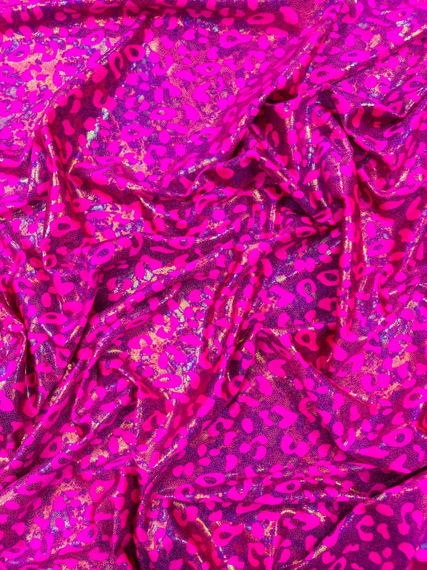 Leopard oil spill metallic print on a stretch nylon spandex| New Creations Fabric & Foam Inc. - New Creations Fabric & Foam Inc