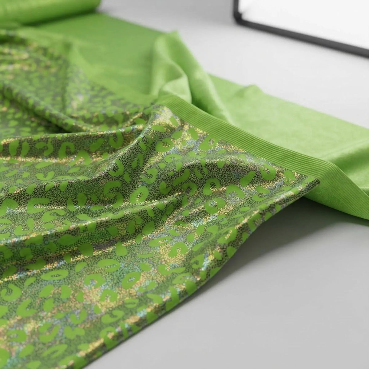 Leopard oil spill metallic print on a stretch nylon spandex| New Creations Fabric & Foam Inc. - New Creations Fabric & Foam Inc