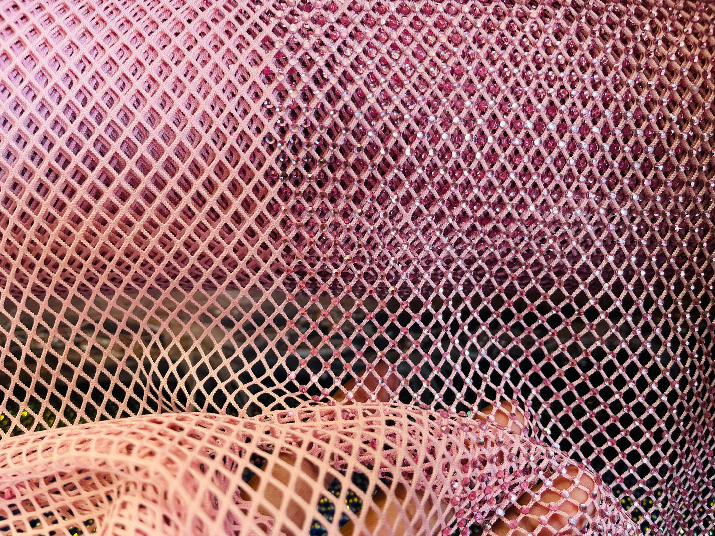 AB Rhinestones on a fish net fabric | New Creation Fabric & Foam Inc.