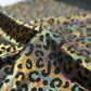 Leopard oil spill metallic print on a stretch nylon spandex| New Creations Fabric & Foam Inc. - New Creations Fabric & Foam Inc
