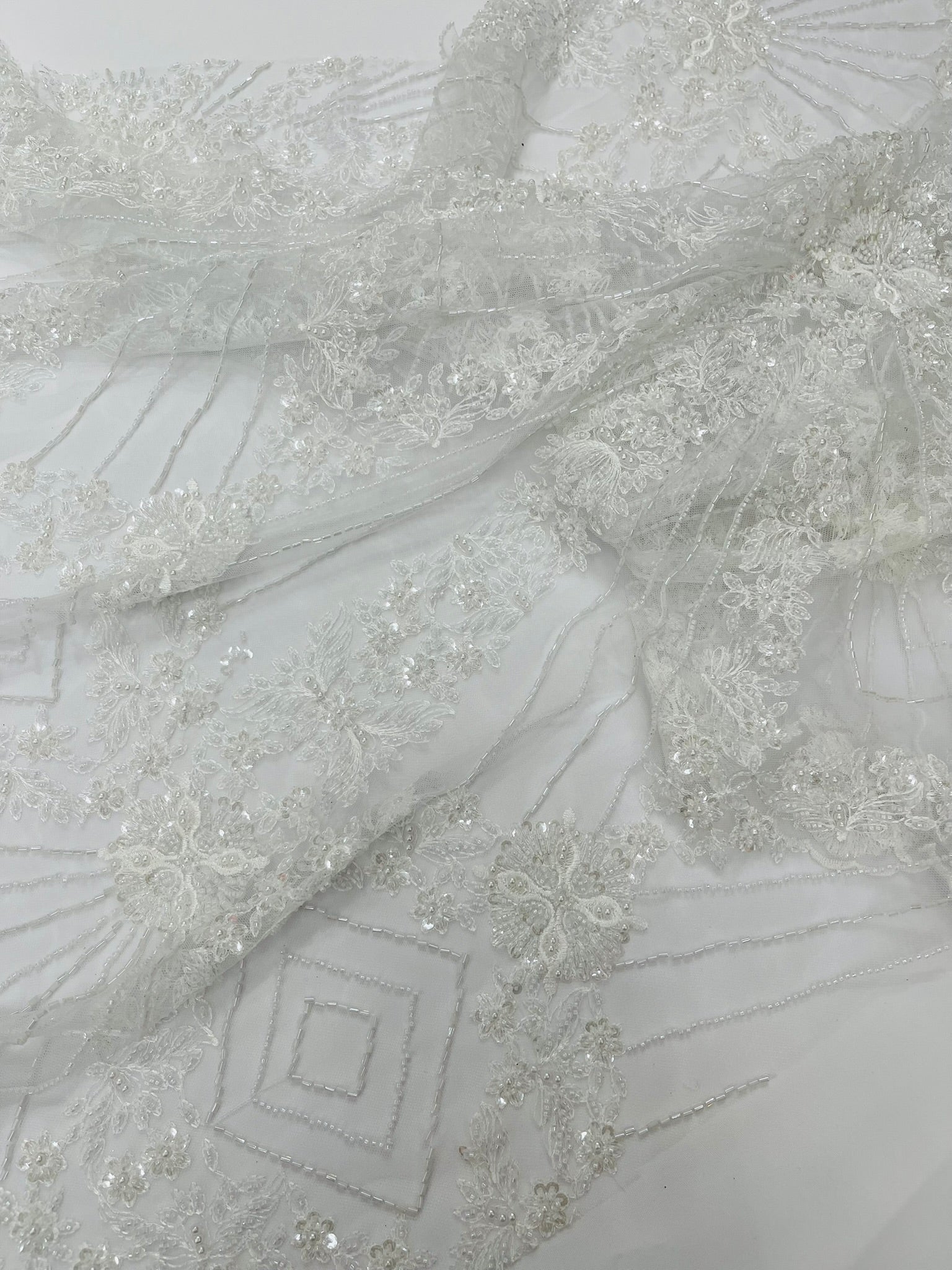 Luxury Bridal Fabric with Geometric Beading on a mesh 54” Wide| New Creations Fabric & Foam Inc. - New Creations Fabric & Foam Inc