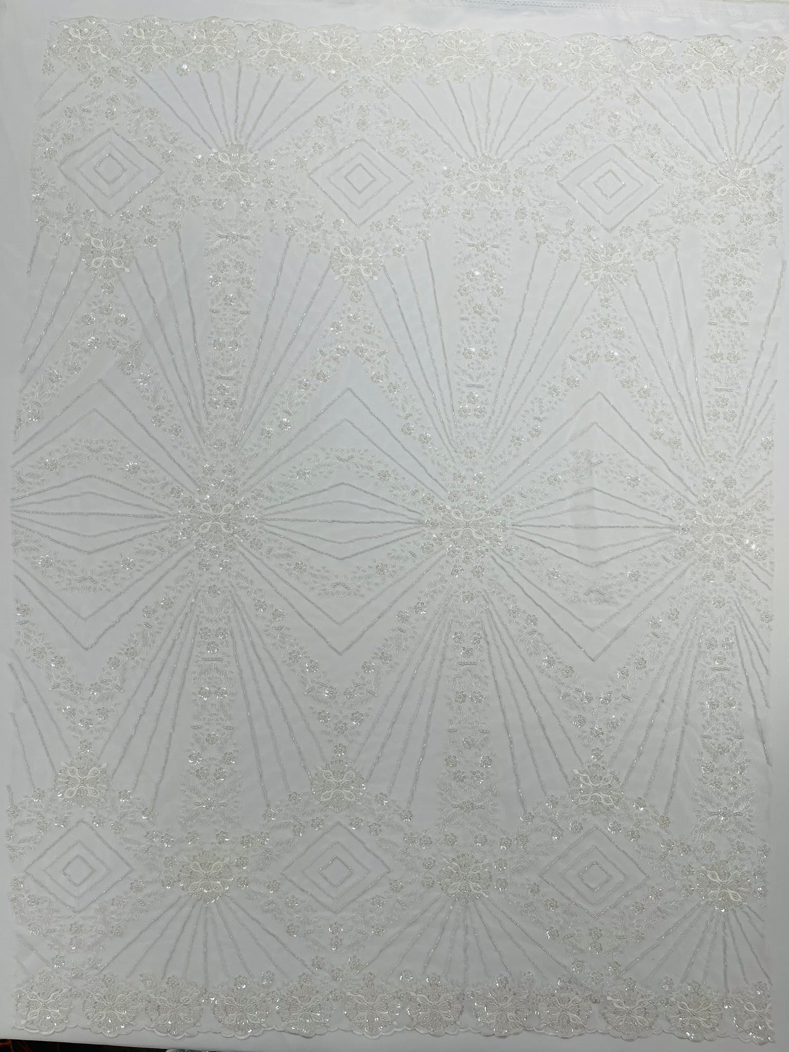 Luxury Bridal Fabric with Geometric Beading on a mesh 54” Wide| New Creations Fabric & Foam Inc. - New Creations Fabric & Foam Inc