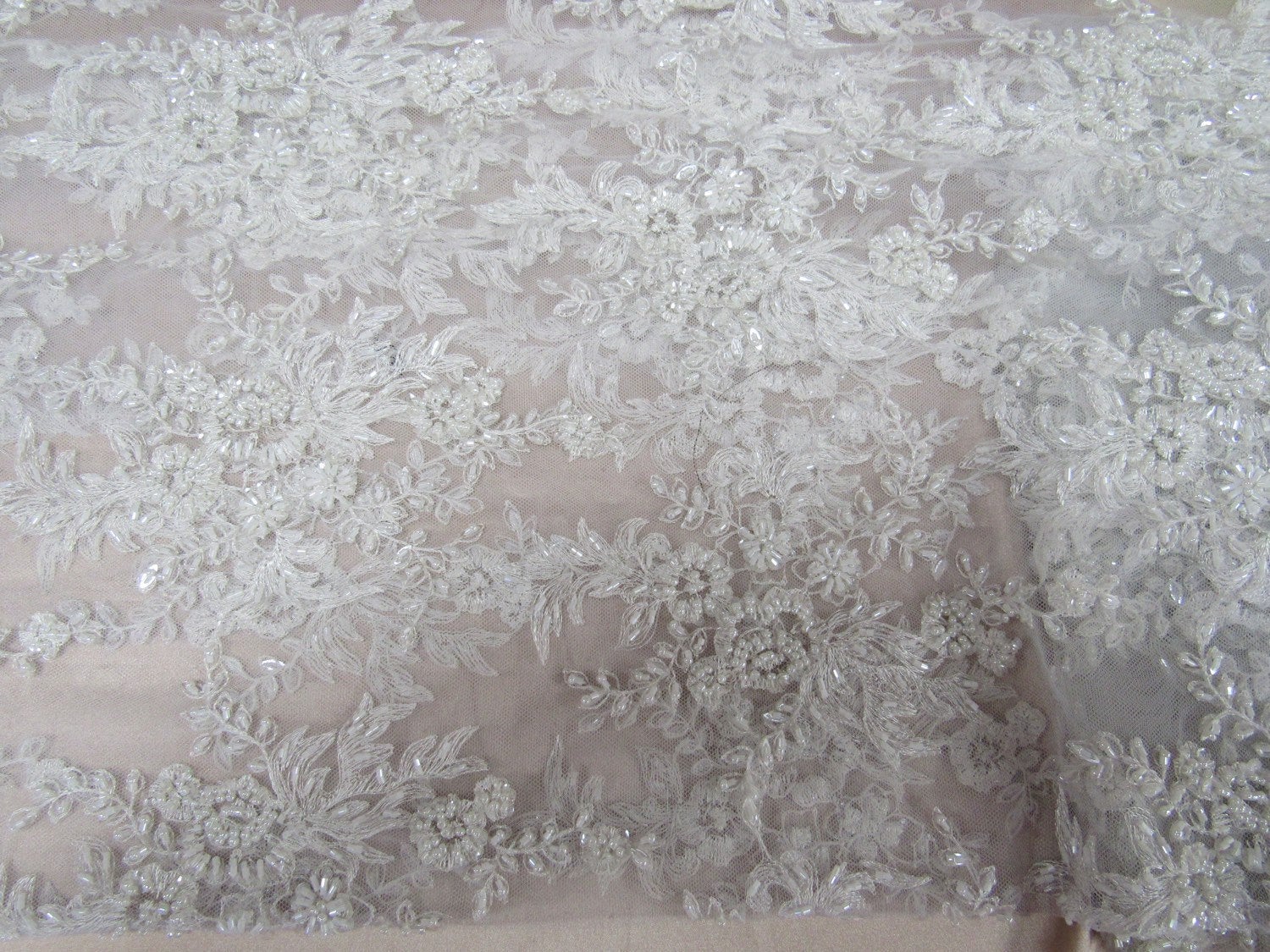 Gorgeous white French design embroider and beaded on a mesh lace. Wedding/Bridal/Prom/Nightgown fabric. - New Creations Fabric & Foam Inc