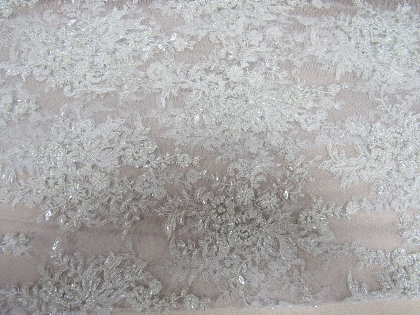 Gorgeous white French design embroider and beaded on a mesh lace. Wedding/Bridal/Prom/Nightgown fabric. - New Creations Fabric & Foam Inc