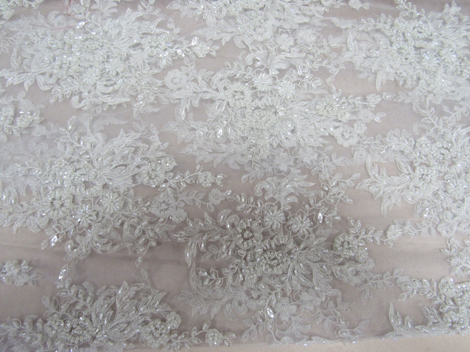 Gorgeous white French design embroider and beaded on a mesh lace. Wedding/Bridal/Prom/Nightgown fabric. - New Creations Fabric & Foam Inc