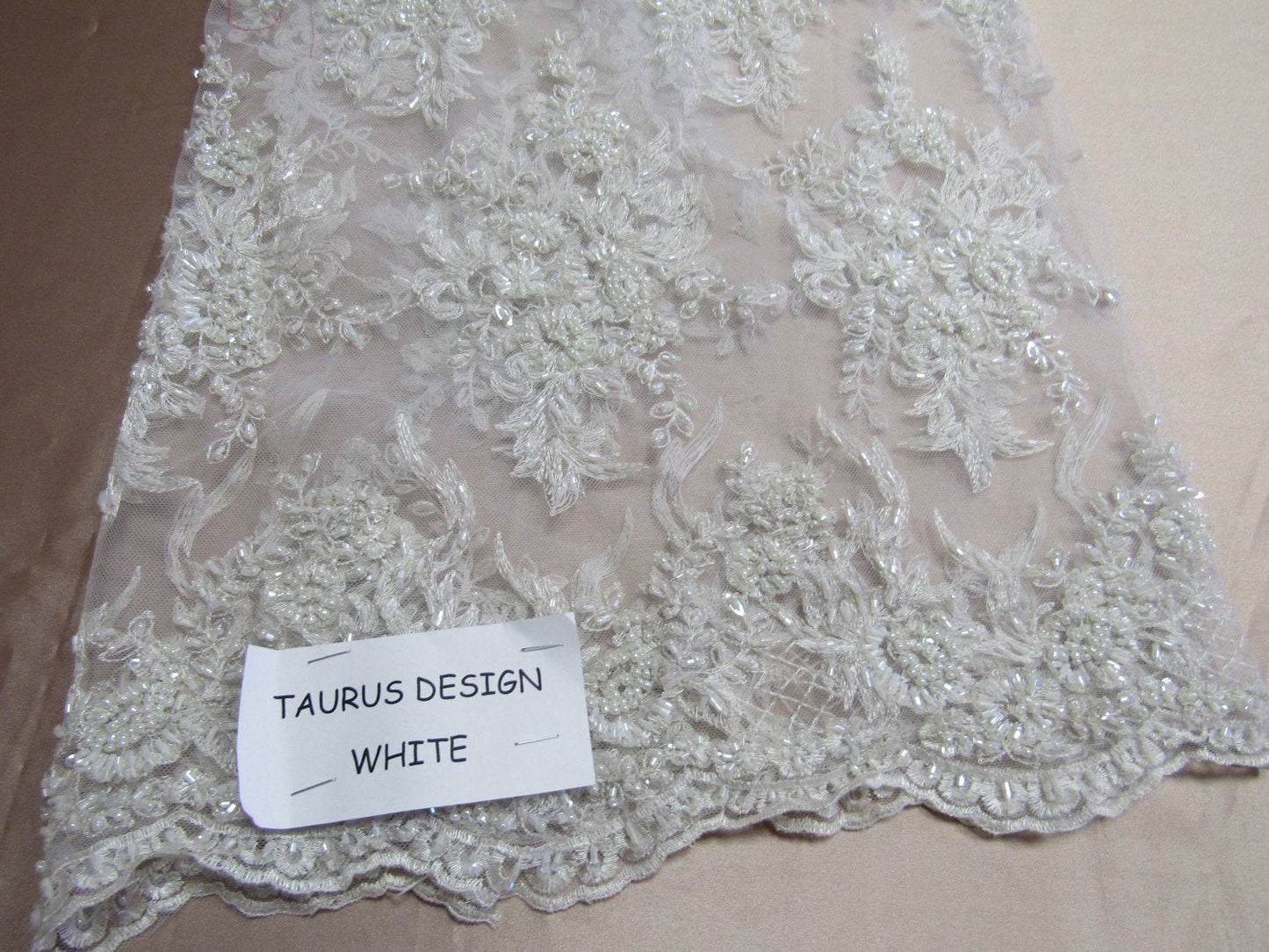 Gorgeous white French design embroider and beaded on a mesh lace. Wedding/Bridal/Prom/Nightgown fabric. - New Creations Fabric & Foam Inc