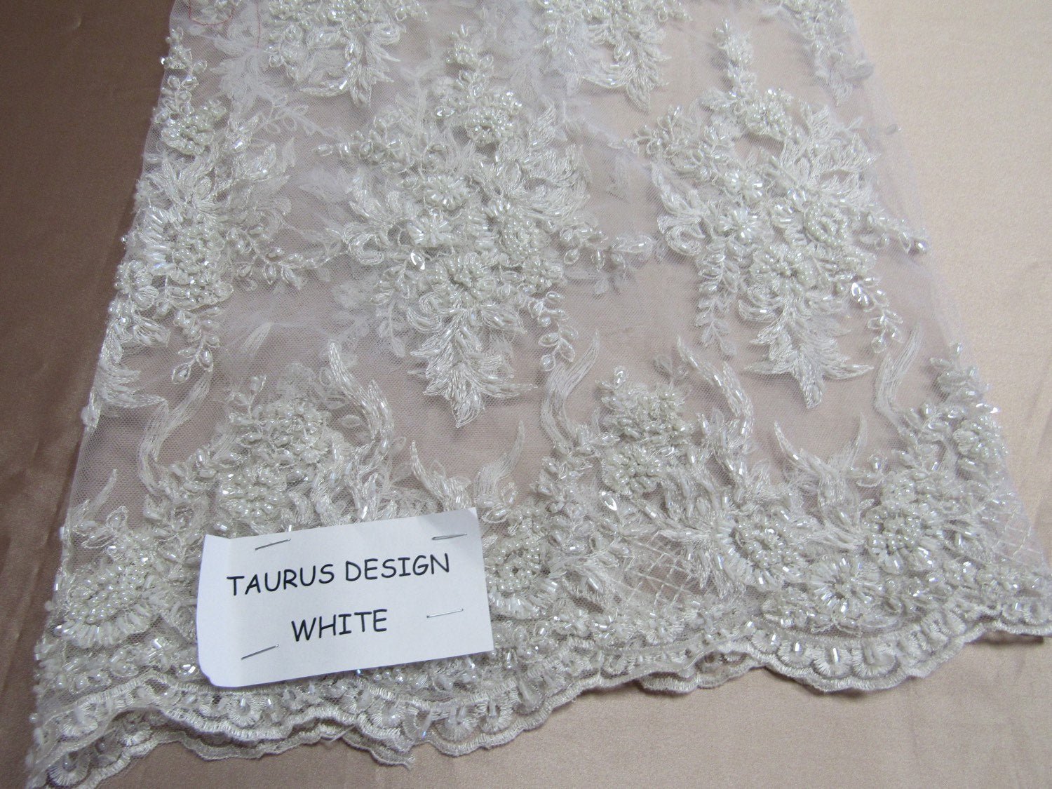 Gorgeous white French design embroider and beaded on a mesh lace. Wedding/Bridal/Prom/Nightgown fabric. - New Creations Fabric & Foam Inc