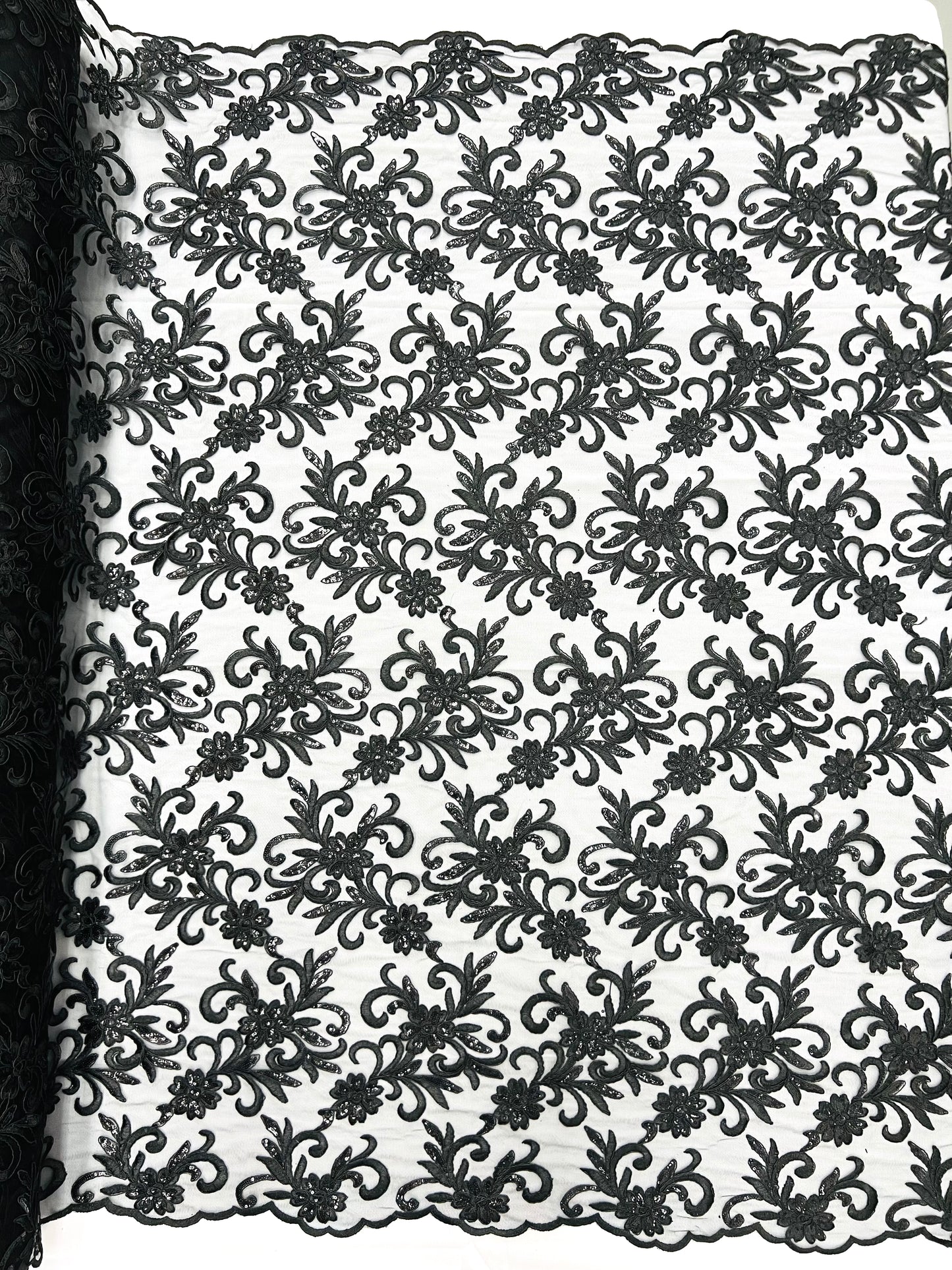 Estrella corded flowers embroider with sequins on a mesh lace fabric-sold by the yard.