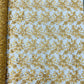 Estrella corded flowers embroider with sequins on a mesh lace fabric-sold by the yard.