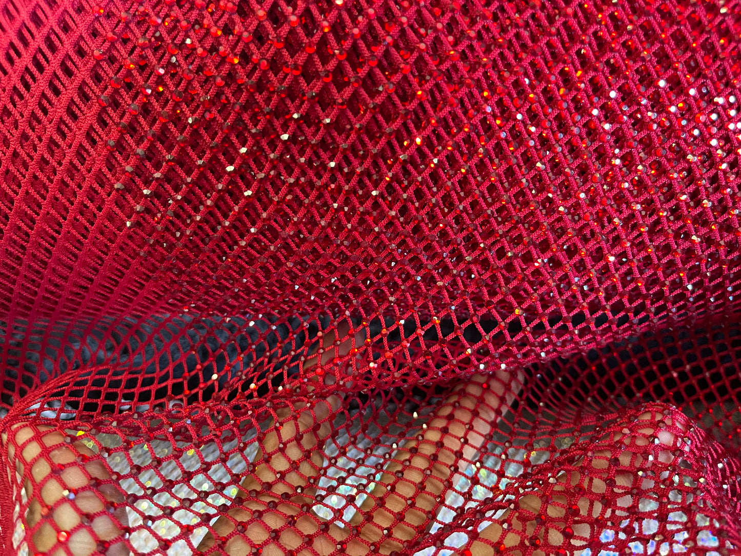 AB Rhinestones on a fish net fabric | New Creation Fabric & Foam Inc.