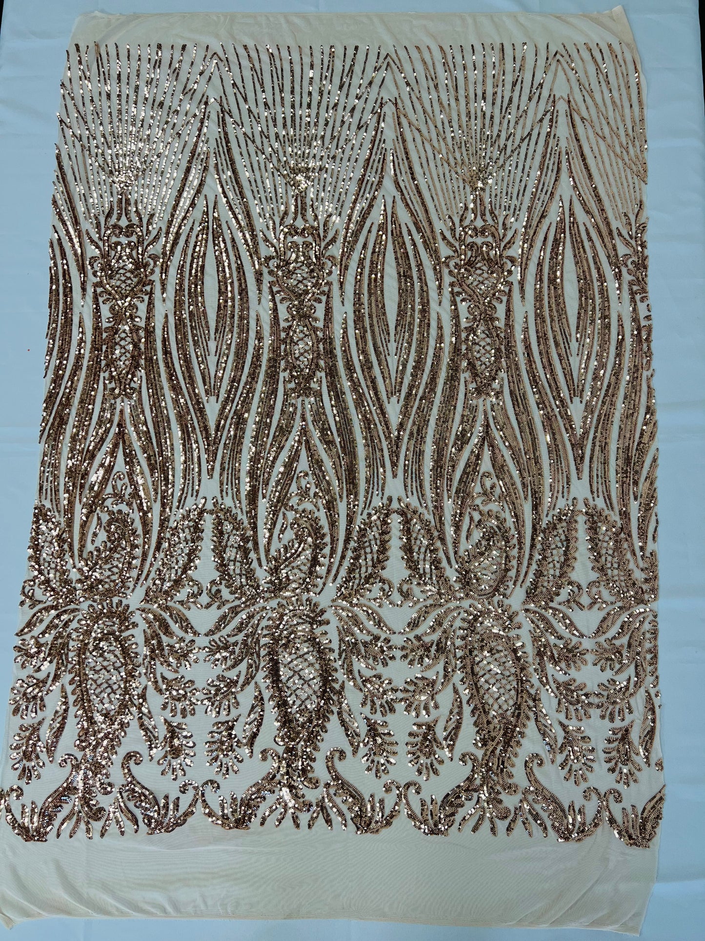 Paisley sequin design on a nude 4 way stretch mesh-prom-sold by the yard.