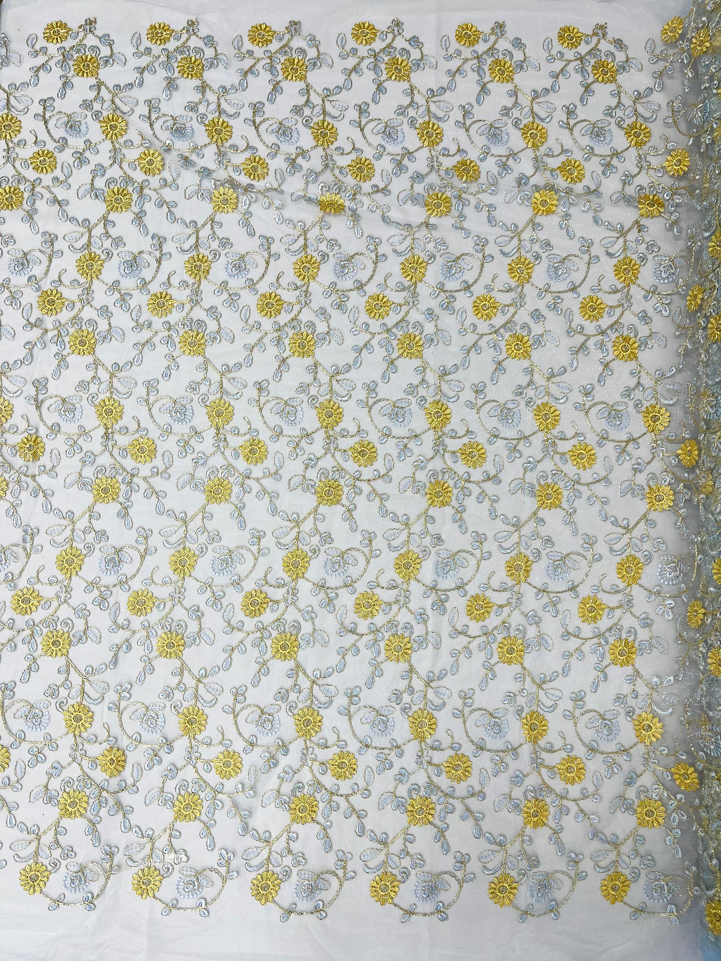 Daisy multi color gold metallic floral design embroider on a red mesh lace-dresses-sold by the yard.