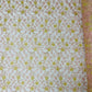 Daisy multi color gold metallic floral design embroider on a red mesh lace-dresses-sold by the yard.