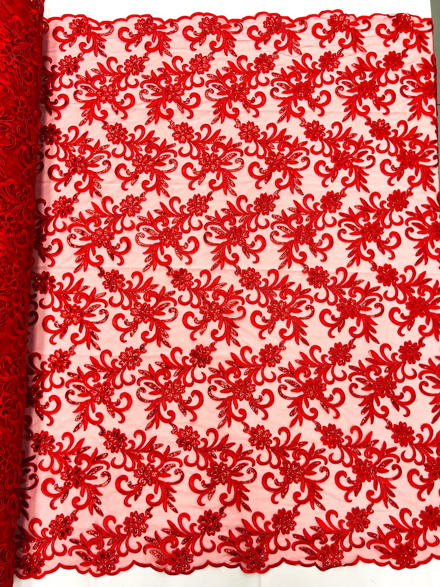 Estrella corded flowers embroider with sequins on a mesh lace fabric-sold by the yard.