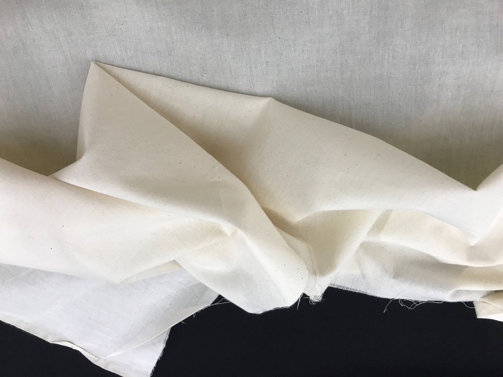 Ivory Muslin natural 100% cotton medium quality unbleached fabric - 45 - 48" wide - pattern maker fabric - sold by the yard. - New Creations Fabric & Foam Inc