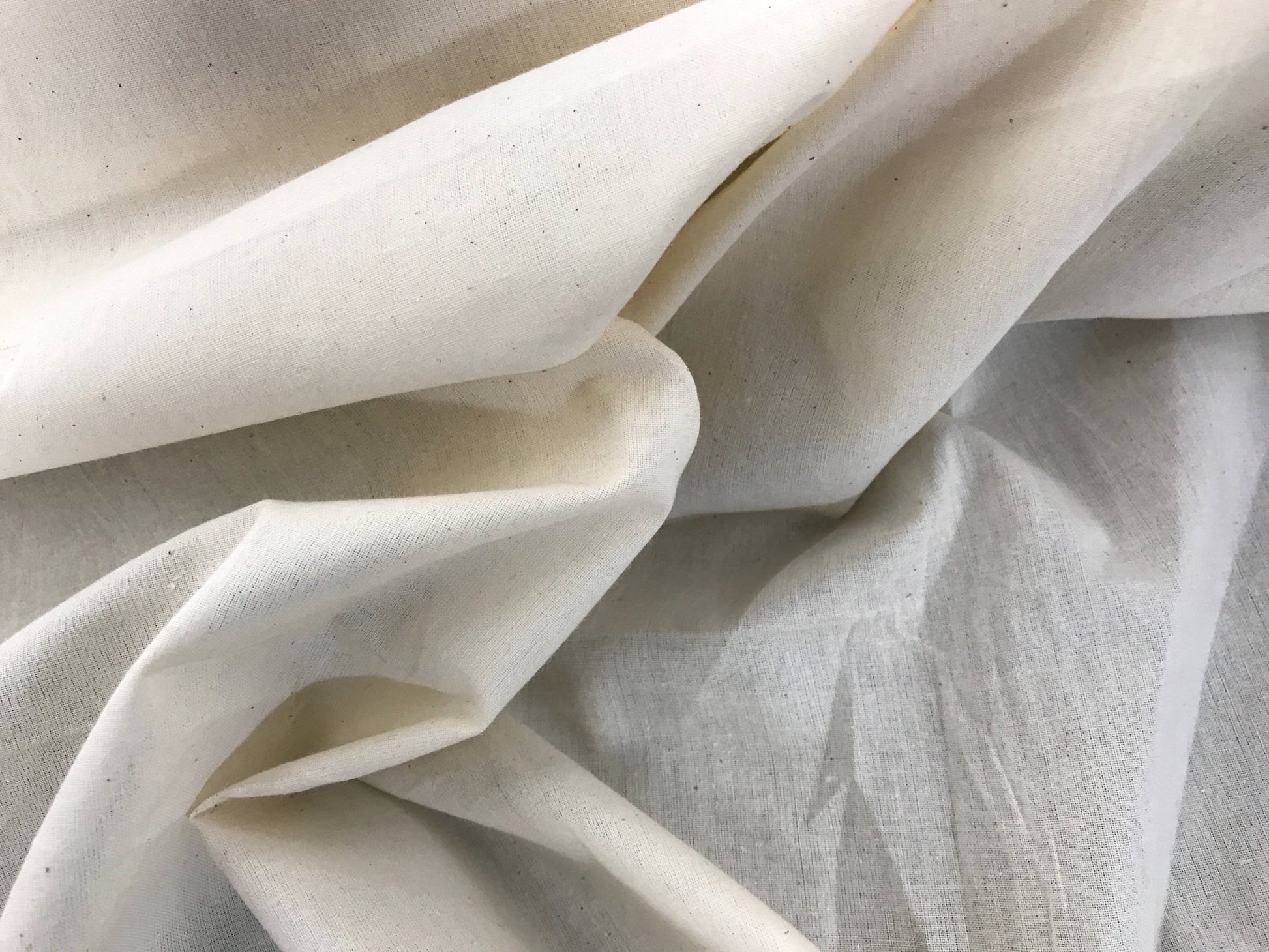 Ivory Muslin natural 100% cotton medium quality unbleached fabric - 45 - 48" wide - pattern maker fabric - sold by the yard. - New Creations Fabric & Foam Inc