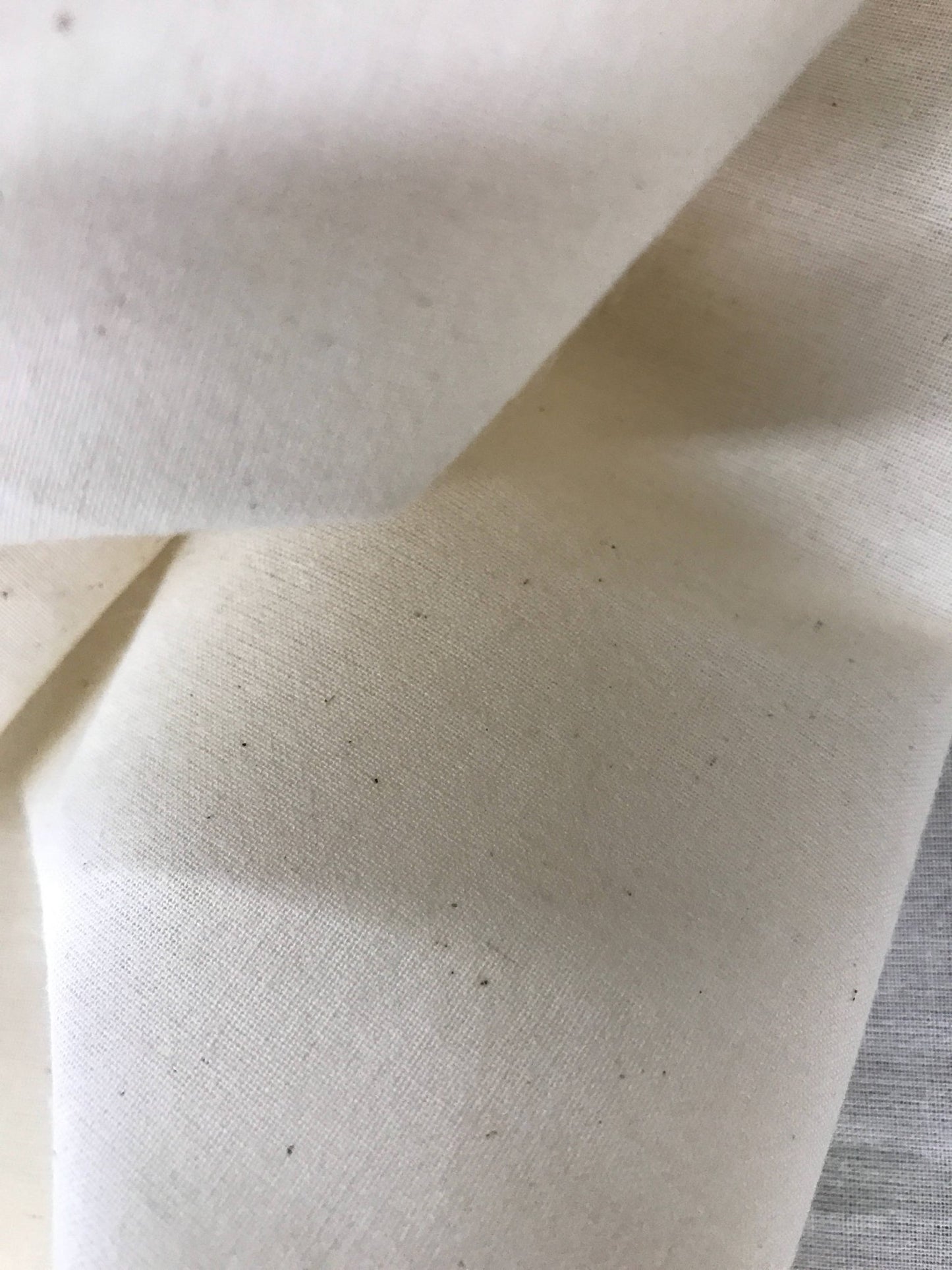 Ivory Muslin natural 100% cotton medium quality unbleached fabric - 45 - 48" wide - pattern maker fabric - sold by the yard. - New Creations Fabric & Foam Inc