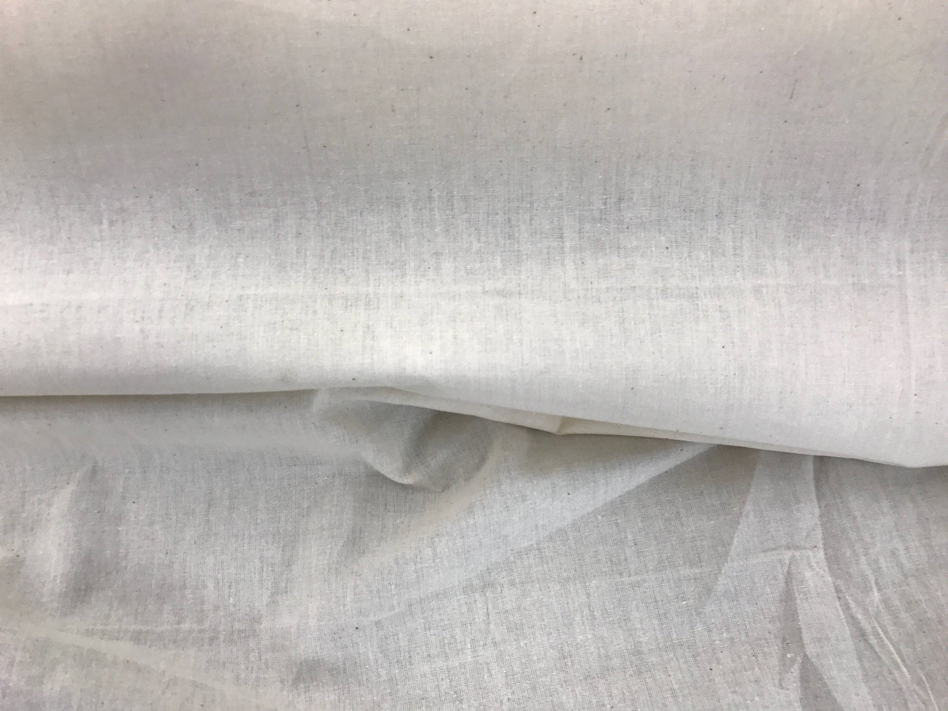 Ivory Muslin natural 100% cotton medium quality unbleached fabric - 45 - 48" wide - pattern maker fabric - sold by the yard. - New Creations Fabric & Foam Inc